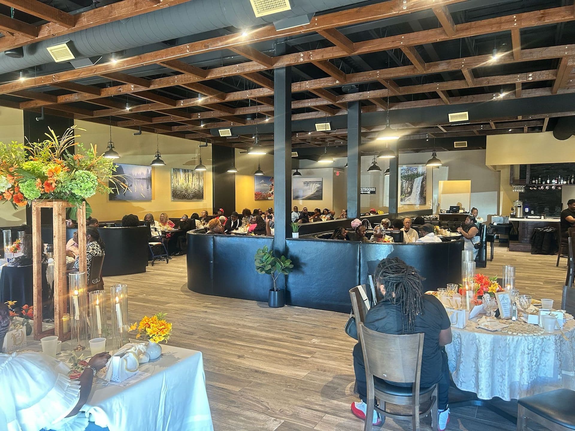 Private event in the Restaurant Lounge with the bar and floral centerpieces