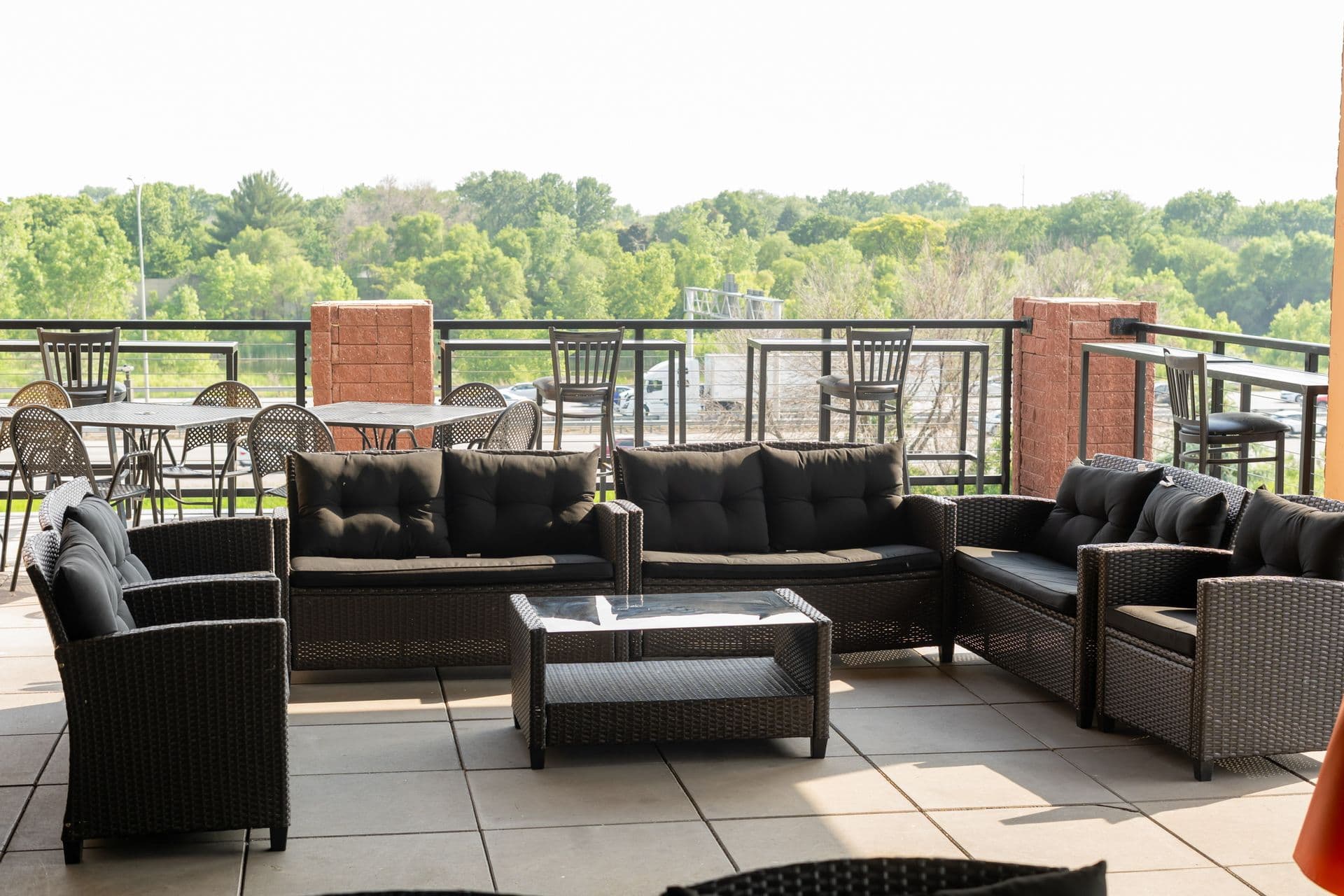 Rooftop Lounge seating with treetop views at BB's Events & Restaurant in Brooklyn Center